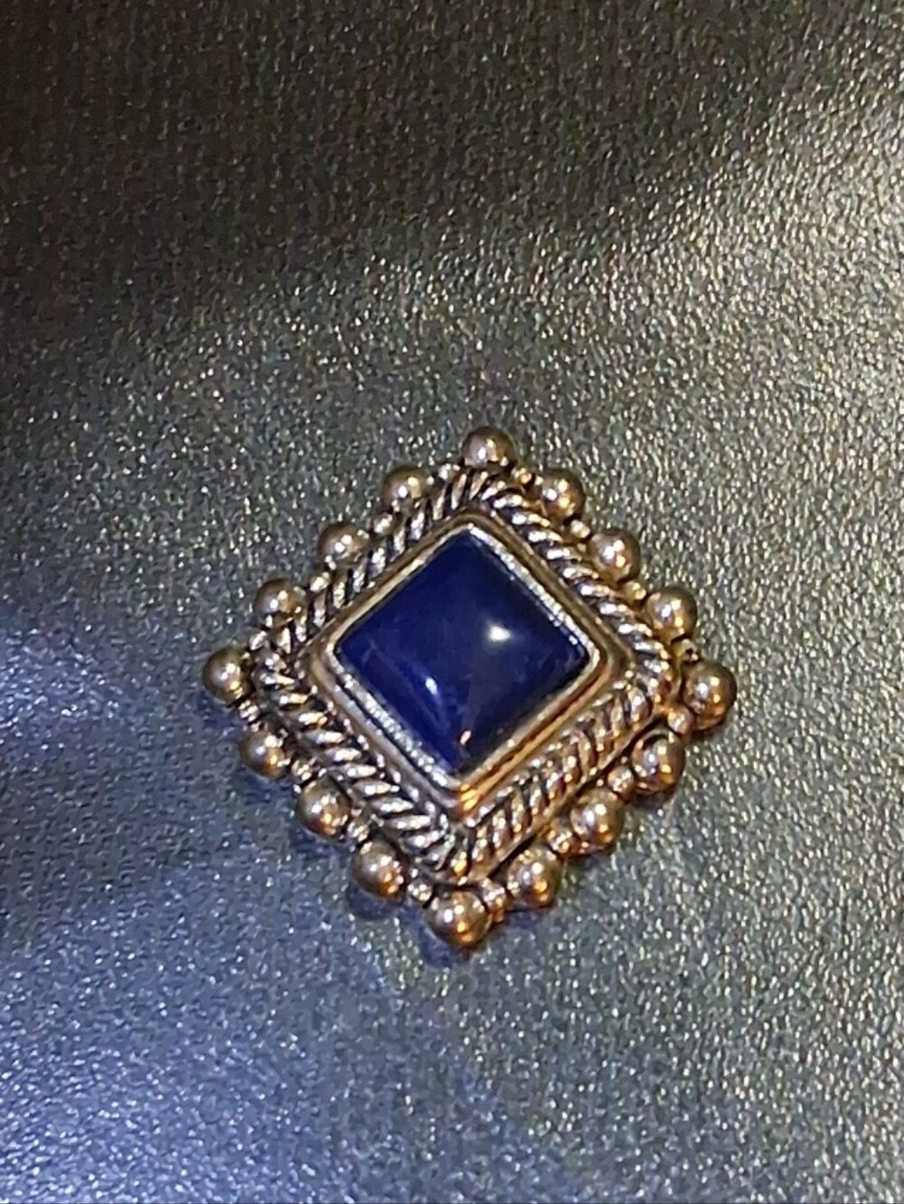 Siver vintage rhombus w beautiful designs around poured glass or lupis lazuli
